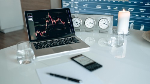 Person reviewing Bitcoin purchase flow on a laptop — exchange rate, quote and BTC amount